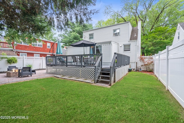 15 Park Blvd, Ocean Twp, NJ 07712 - rear view of house featuring a fire pit, a deck, a fenced backyard, and a patio