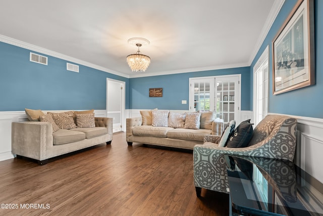 79 Cypress Neck Rd, Lincroft, NJ 07738 - living room featuring french doors, a wainscoted wall, crown molding, a chandelier, and dark wood-style flooring