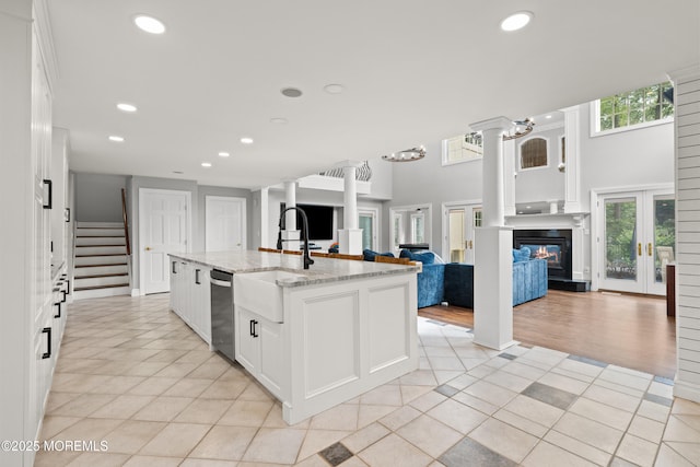 79 Cypress Neck Rd, Lincroft, NJ 07738 - kitchen featuring open floor plan, stainless steel dishwasher, white cabinetry, light tile patterned floors, and recessed lighting