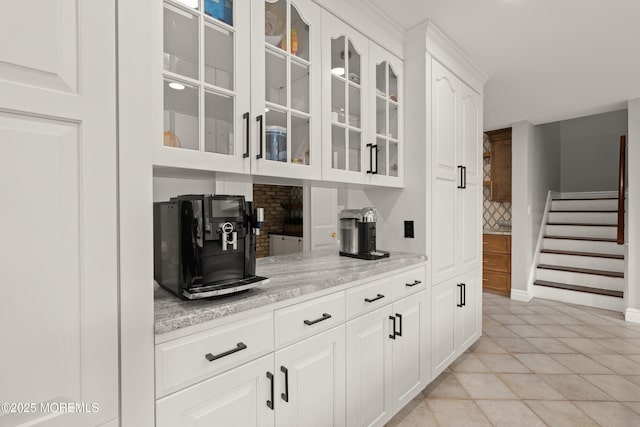 79 Cypress Neck Rd, Lincroft, NJ 07738 - bar area with tasteful backsplash, stairway, and light tile patterned floors