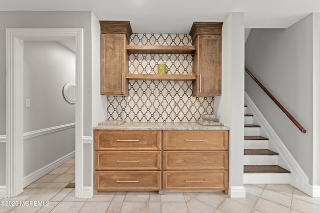 79 Cypress Neck Rd, Lincroft, NJ 07738 - kitchen featuring decorative backsplash, open shelves, light stone countertops, and light tile patterned floors