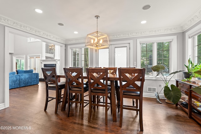 79 Cypress Neck Rd, Lincroft, NJ 07738 - dining space featuring a chandelier, crown molding, dark wood-style floors, a fireplace, and recessed lighting