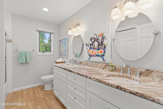 79 Cypress Neck Rd, Lincroft, NJ 07738 - bathroom with double vanity, wood finished floors, recessed lighting, and enclosed tub / shower combo