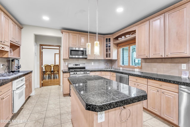 100 Case Rd, Lakewood, NJ 08701 - kitchen with stainless steel appliances, backsplash, recessed lighting, a kitchen island, and light tile patterned floors
