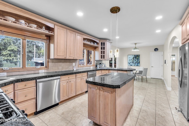 100 Case Rd, Lakewood, NJ 08701 - kitchen with appliances with stainless steel finishes, light brown cabinets, arched walkways, plenty of natural light, and recessed lighting