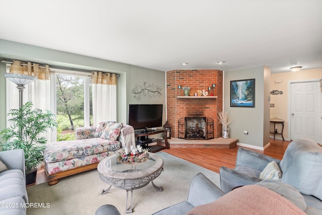 56 Violet Ct, Toms River, NJ 08753 - living room with wood finished floors and a brick fireplace