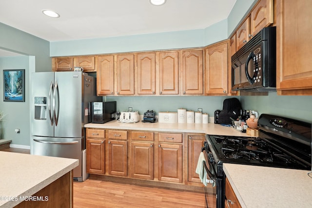 56 Violet Ct, Toms River, NJ 08753 - kitchen featuring black appliances, light countertops, light wood finished floors, and recessed lighting