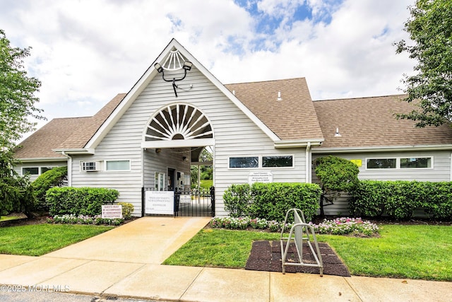 56 Violet Ct, Toms River, NJ 08753 - view of front facade featuring a gate, roof with shingles, concrete driveway, and a front lawn