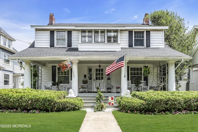 28 Broadway Rd, Freehold, NJ 07728 - view of front facade with covered porch, a chimney, a front lawn, and roof with shingles