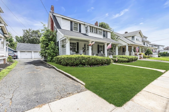 28 Broadway Rd, Freehold, NJ 07728 - view of front facade with covered porch, a chimney, a garage, an outdoor structure, and a front yard