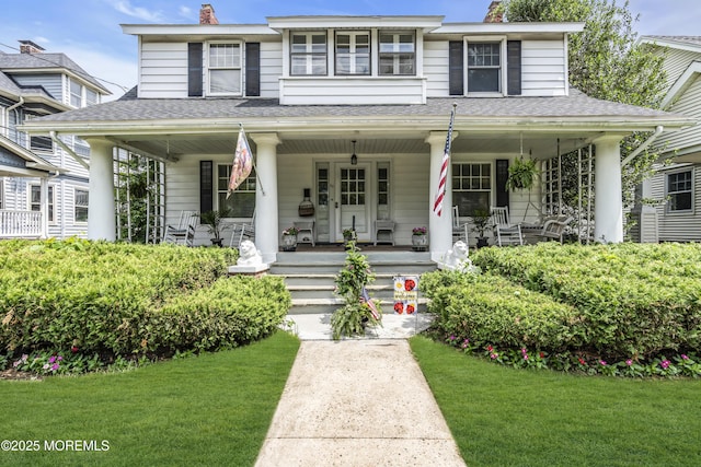 28 Broadway Rd, Freehold, NJ 07728 - view of front of home featuring a chimney, a porch, roof with shingles, and a front lawn