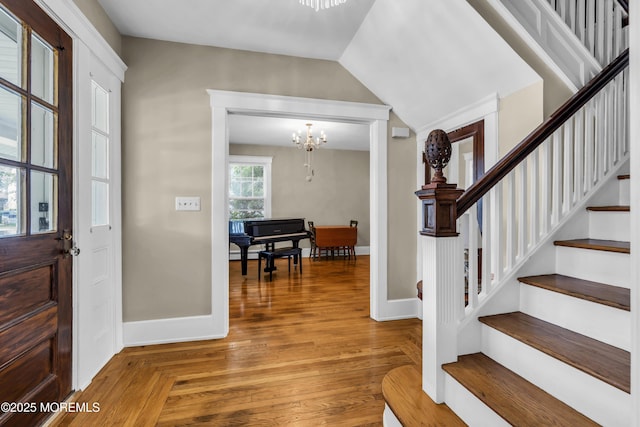 28 Broadway Rd, Freehold, NJ 07728 - entryway with a chandelier, stairway, and wood finished floors