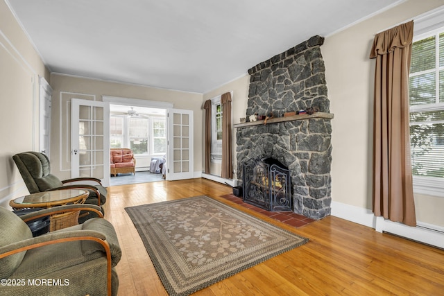 28 Broadway Rd, Freehold, NJ 07728 - living room with wood-type flooring, french doors, healthy amount of natural light, and ornamental molding