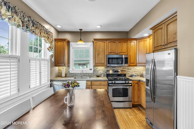 28 Broadway Rd, Freehold, NJ 07728 - kitchen with stainless steel appliances, hanging light fixtures, tasteful backsplash, light wood-style floors, and recessed lighting