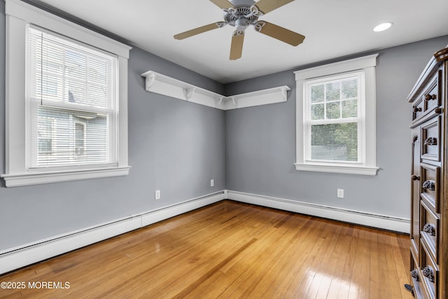 28 Broadway Rd, Freehold, NJ 07728 - unfurnished room featuring a baseboard radiator, hardwood / wood-style floors, and a ceiling fan