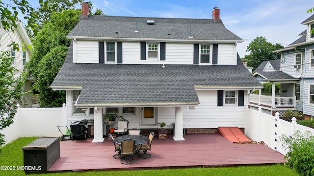 28 Broadway Rd, Freehold, NJ 07728 - back of house featuring a fenced backyard, a chimney, a deck, and roof with shingles