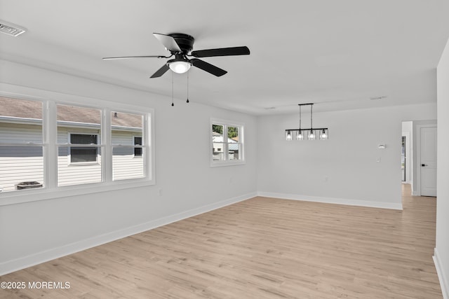 503 Jamaica Blvd, Toms River, NJ 08757 - spare room with ceiling fan, light wood-style flooring, and a chandelier