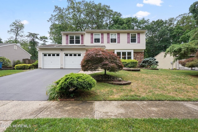 11 Hazelwood Ct, Howell, NJ 07731 - view of front of house featuring asphalt driveway and a front yard