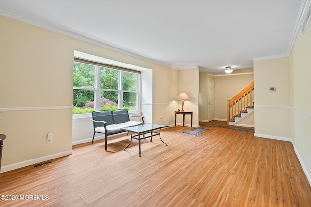 11 Hazelwood Ct, Howell, NJ 07731 - sitting room with light wood-style flooring, stairway, and crown molding