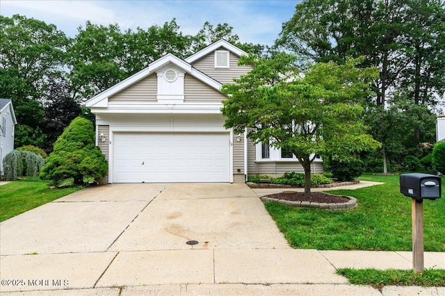 2331 Kira Ct, Toms River, NJ 08755 - view of front of house with driveway, an attached garage, and a front lawn