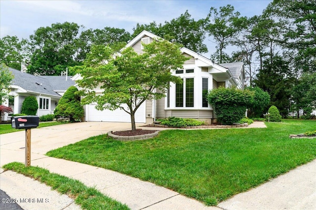 2331 Kira Ct, Toms River, NJ 08755 - view of front of house with driveway, a front lawn, and a garage