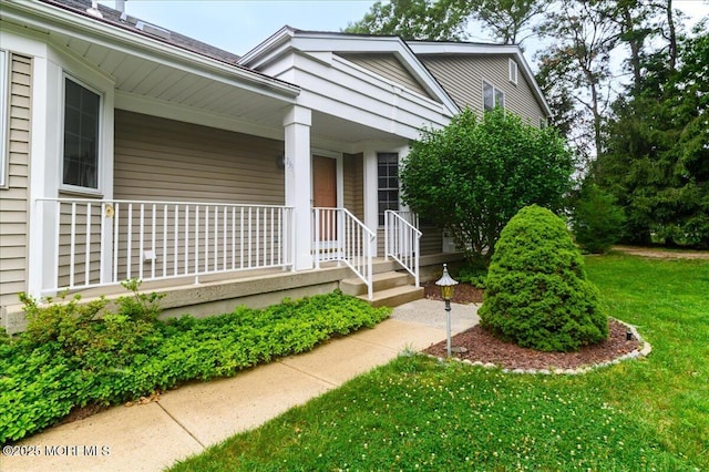 2331 Kira Ct, Toms River, NJ 08755 - doorway to property featuring a porch and a lawn