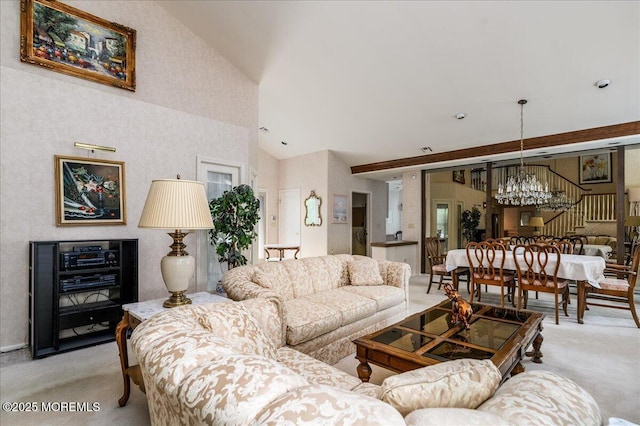 2331 Kira Ct, Toms River, NJ 08755 - living room with a chandelier, light carpet, high vaulted ceiling, and stairs