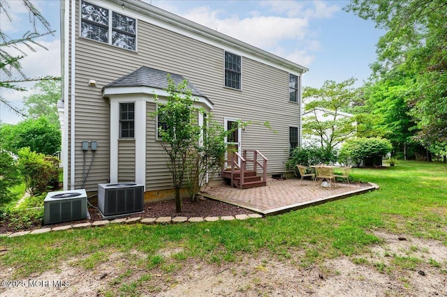 2331 Kira Ct, Toms River, NJ 08755 - rear view of property with a patio and a lawn