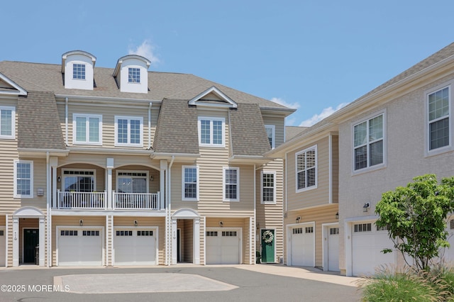 408 April Way, Middletown, NJ 07748 - townhome / multi-family property featuring a garage, driveway, and roof with shingles