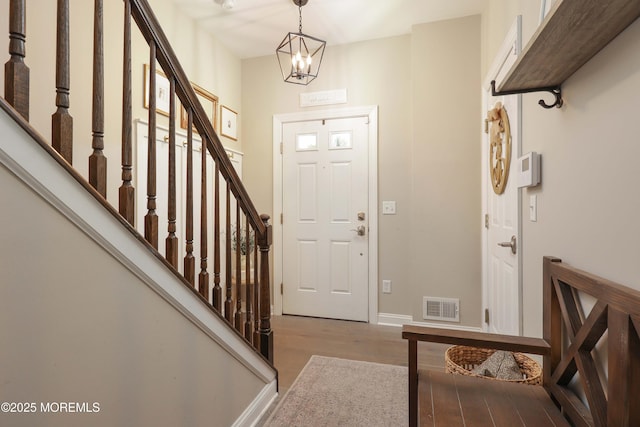 408 April Way, Middletown, NJ 07748 - foyer entrance featuring wood finished floors, stairs, and a chandelier