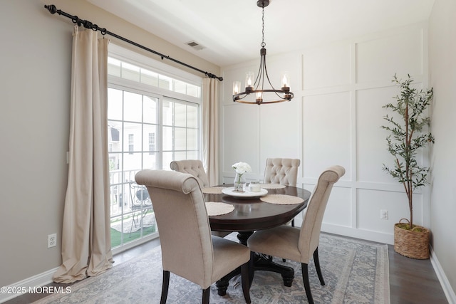 408 April Way, Middletown, NJ 07748 - dining space featuring a decorative wall, a chandelier, healthy amount of natural light, and wood finished floors