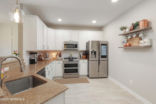 408 April Way, Middletown, NJ 07748 - kitchen with stainless steel appliances, light stone countertops, tasteful backsplash, white cabinets, and recessed lighting