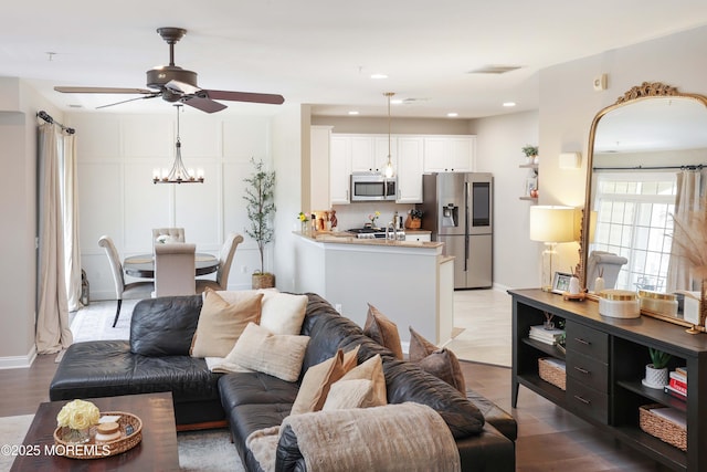 408 April Way, Middletown, NJ 07748 - living area with ceiling fan, wood finished floors, a chandelier, and recessed lighting