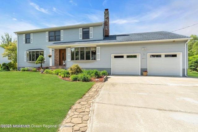 444 Pfister Rd, Jackson, NJ 08527 - traditional-style house featuring driveway, an attached garage, a front lawn, and a chimney