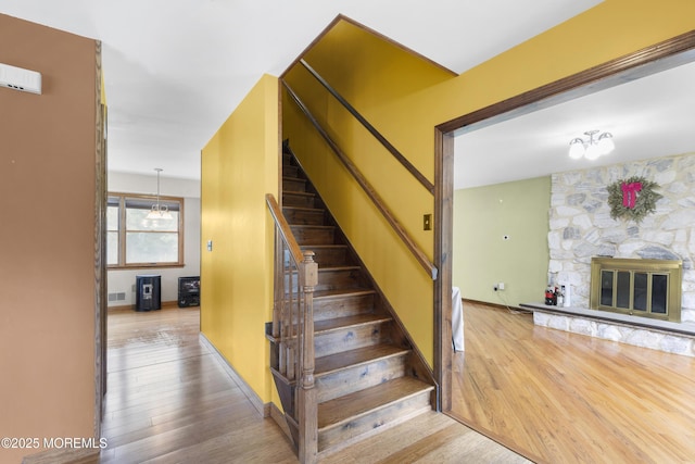 444 Pfister Rd, Jackson, NJ 08527 - stairway featuring wood finished floors and a stone fireplace