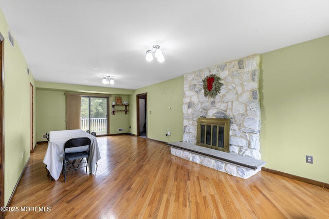 444 Pfister Rd, Jackson, NJ 08527 - unfurnished living room featuring wood finished floors and a fireplace