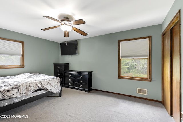 444 Pfister Rd, Jackson, NJ 08527 - bedroom with light carpet, a closet, and a ceiling fan