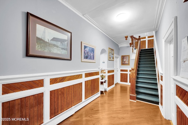402 2nd Ave, Long Branch, NJ 07740 - hall featuring crown molding, light wood finished floors, stairs, and a wainscoted wall