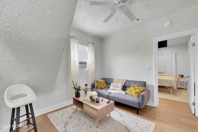 402 2nd Ave, Long Branch, NJ 07740 - living room with wood finished floors, a textured wall, and ceiling fan