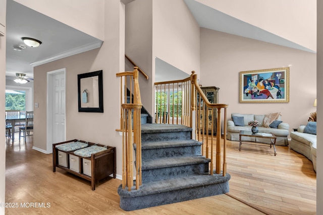 16 Arrowhead Way, Millstone, NJ 08535 - staircase with wood finished floors, ceiling fan, crown molding, and a high ceiling