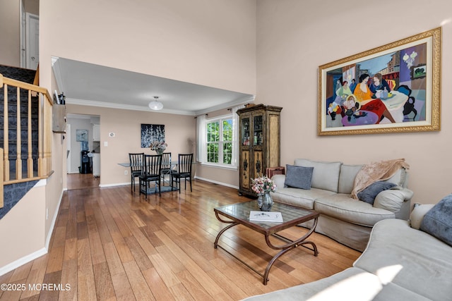 16 Arrowhead Way, Millstone, NJ 08535 - living area featuring hardwood / wood-style flooring, stairway, and ornamental molding