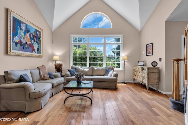 16 Arrowhead Way, Millstone, NJ 08535 - living room featuring light wood finished floors, plenty of natural light, and lofted ceiling