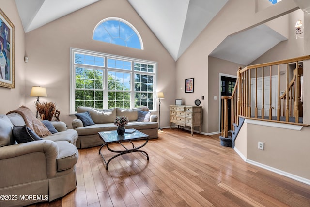 16 Arrowhead Way, Millstone, NJ 08535 - living area featuring lofted ceiling, hardwood / wood-style flooring, and stairway