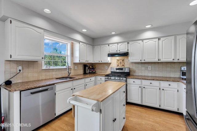 16 Arrowhead Way, Millstone, NJ 08535 - kitchen with appliances with stainless steel finishes, under cabinet range hood, light wood-style floors, white cabinets, and recessed lighting