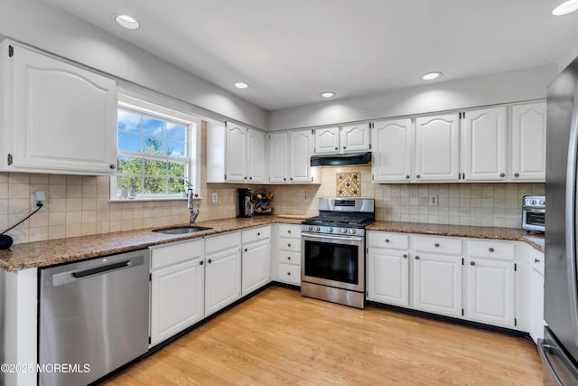 16 Arrowhead Way, Millstone, NJ 08535 - kitchen featuring appliances with stainless steel finishes, under cabinet range hood, stone counters, white cabinets, and recessed lighting