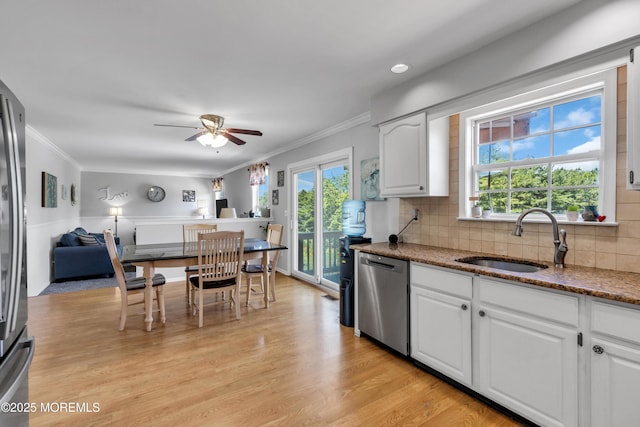 16 Arrowhead Way, Millstone, NJ 08535 - kitchen with dishwasher, a ceiling fan, crown molding, healthy amount of natural light, and stone countertops