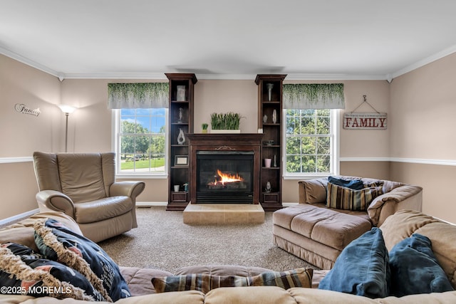 16 Arrowhead Way, Millstone, NJ 08535 - living area featuring healthy amount of natural light, crown molding, a glass covered fireplace, and carpet flooring