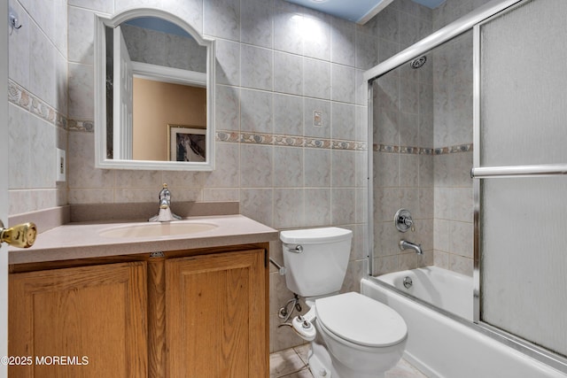 16 Arrowhead Way, Millstone, NJ 08535 - bathroom with tile walls, vanity, combined bath / shower with glass door, and tile patterned flooring