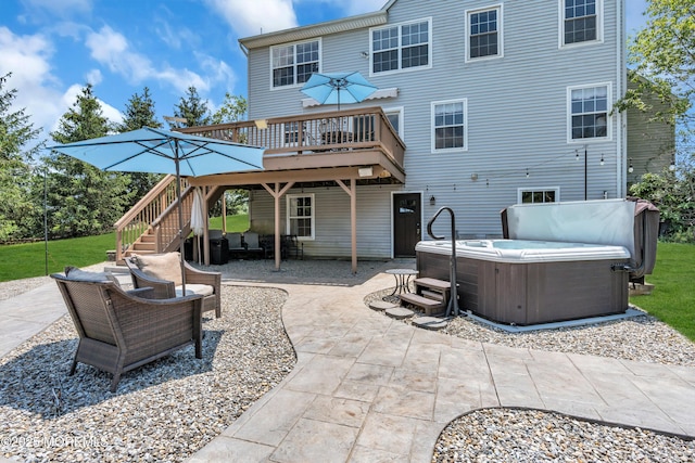 16 Arrowhead Way, Millstone, NJ 08535 - back of property featuring a hot tub, stairs, a wooden deck, and a patio