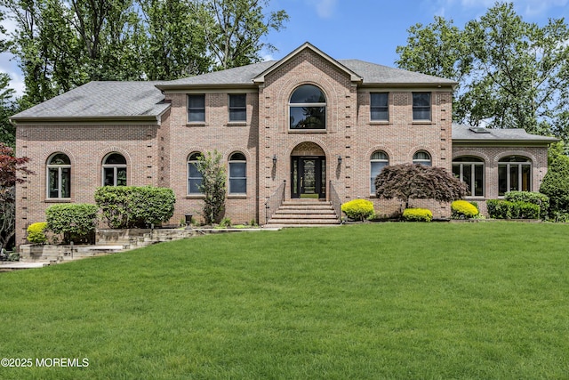2 Shady Oak Ct, Millstone, NJ 08535 - colonial home with a front yard, brick siding, and roof with shingles